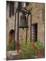 Bronze Bell, Geraniums and Farmhouse, Tuscany, Italy-Merrill Images-Mounted Photographic Print