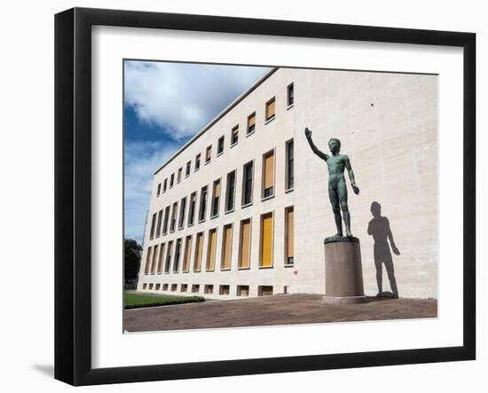 Bronze statue Genio dello Sport outside the Palazzo degli Uffici, Faschist architecture-Jean Brooks-Framed Photographic Print