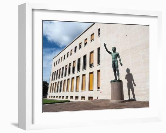 Bronze statue Genio dello Sport outside the Palazzo degli Uffici, Faschist architecture-Jean Brooks-Framed Photographic Print