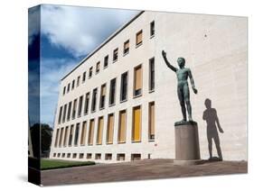Bronze statue Genio dello Sport outside the Palazzo degli Uffici, Faschist architecture-Jean Brooks-Stretched Canvas