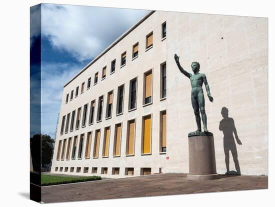 Bronze statue Genio dello Sport outside the Palazzo degli Uffici, Faschist architecture-Jean Brooks-Stretched Canvas