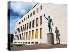 Bronze statue Genio dello Sport outside the Palazzo degli Uffici, Faschist architecture-Jean Brooks-Stretched Canvas