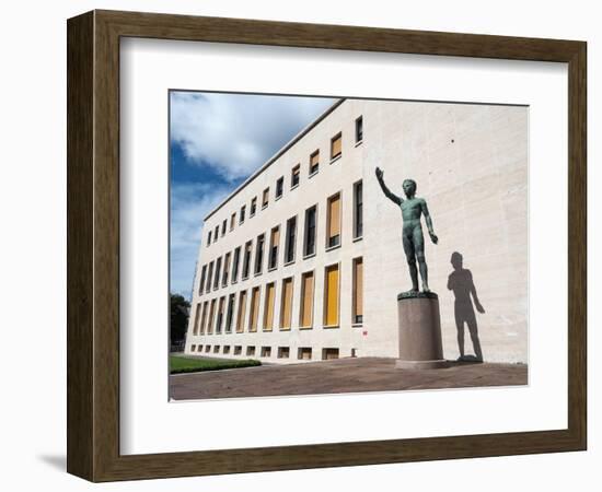 Bronze statue Genio dello Sport outside the Palazzo degli Uffici, Faschist architecture-Jean Brooks-Framed Photographic Print