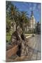 Bronze Statue of a Sailor on a Wooden Bench with Palm Trees-Eleanor Scriven-Mounted Photographic Print