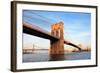 Brooklyn Bridge over East River Viewed from New York City Lower Manhattan Waterfront at Sunset.-Songquan Deng-Framed Photographic Print