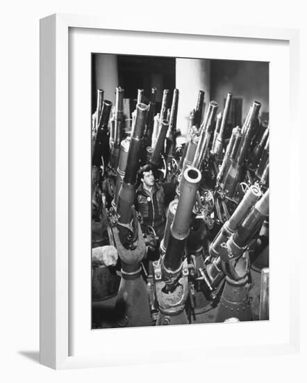 Brooklyn Naval Yard Worker Looking over a Storage of Guns-George Strock-Framed Photographic Print