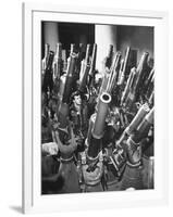 Brooklyn Naval Yard Worker Looking over a Storage of Guns-George Strock-Framed Photographic Print