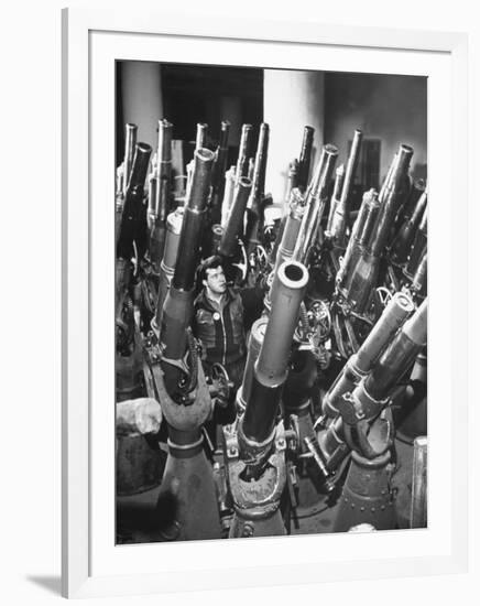 Brooklyn Naval Yard Worker Looking over a Storage of Guns-George Strock-Framed Photographic Print