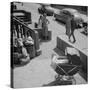 Brooklyn Street Scene, Baby Carriage, Two Women, and a Boy Carrying Dry Cleaning, NY, 1949-Ralph Morse-Stretched Canvas