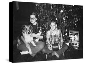 Brother and Sister Pose by the Christmas Tree, Ca. 1960-null-Stretched Canvas