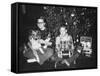 Brother and Sister Pose by the Christmas Tree, Ca. 1960-null-Framed Stretched Canvas