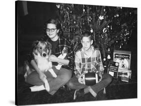 Brother and Sister Pose by the Christmas Tree, Ca. 1960-null-Stretched Canvas