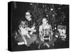 Brother and Sister Pose by the Christmas Tree, Ca. 1960-null-Stretched Canvas