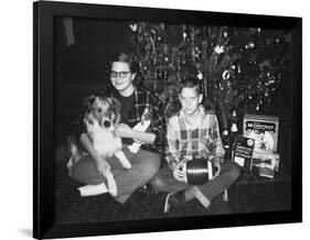 Brother and Sister Pose by the Christmas Tree, Ca. 1960-null-Framed Photographic Print