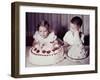 Brother Watches His Sister Blow Out Candles on Birthday Cake, Ca. 1956-null-Framed Photographic Print