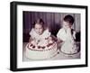 Brother Watches His Sister Blow Out Candles on Birthday Cake, Ca. 1956-null-Framed Photographic Print