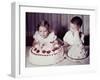 Brother Watches His Sister Blow Out Candles on Birthday Cake, Ca. 1956-null-Framed Photographic Print