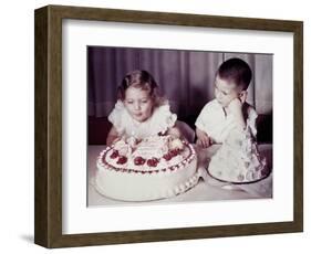 Brother Watches His Sister Blow Out Candles on Birthday Cake, Ca. 1956-null-Framed Photographic Print