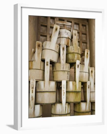 Buckets Stacked at Yasaka Shrine in Kyoto-Rudy Sulgan-Framed Photographic Print