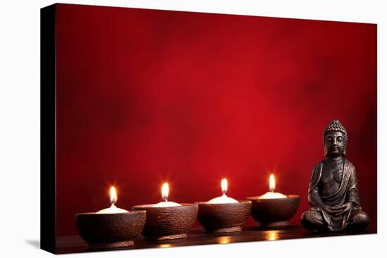 Buddha and Candles on Red Background, Religious Concept.-Sofiaworld-Stretched Canvas