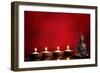 Buddha and Candles on Red Background, Religious Concept.-Sofiaworld-Framed Photographic Print