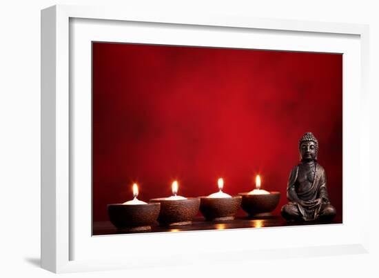 Buddha and Candles on Red Background, Religious Concept.-Sofiaworld-Framed Photographic Print