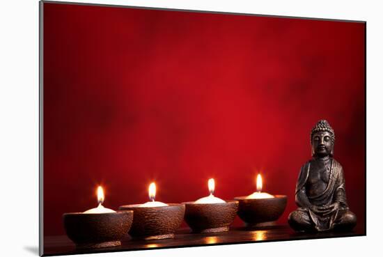 Buddha and Candles on Red Background, Religious Concept.-Sofiaworld-Mounted Photographic Print