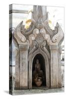 Buddha Statue and Water Pot Left by Buddhist Devotee Inside Shrine-Annie Owen-Stretched Canvas