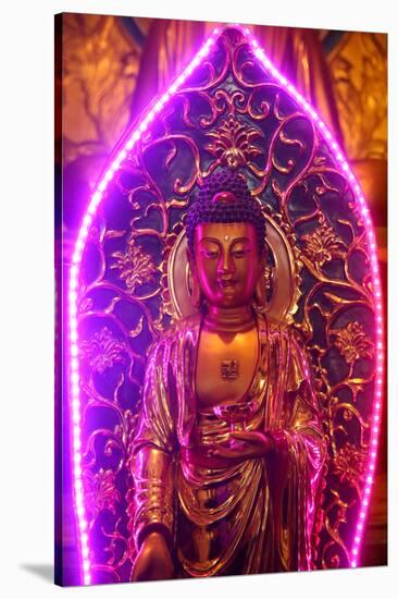 Buddha statue with neon light, Chua Thien Hung Buddhist Pagoda, Ho Chi Minh City, Vietnam, Indochin-null-Stretched Canvas