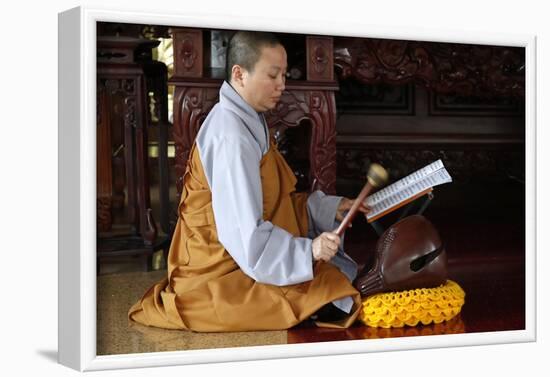 Buddhist ceremony at temple, monk playing on a wooden fish (percussion instrument)-Godong-Framed Photographic Print