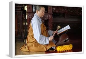 Buddhist ceremony at temple, monk playing on a wooden fish (percussion instrument)-Godong-Framed Photographic Print