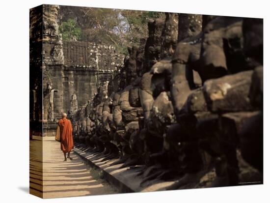 Buddhist Monk Approaching South Gate, Angkor Thom, Angkor, Cambodia, Indochina-Andrew Mcconnell-Stretched Canvas