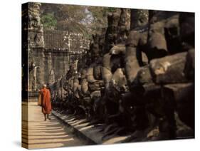 Buddhist Monk Approaching South Gate, Angkor Thom, Angkor, Cambodia, Indochina-Andrew Mcconnell-Stretched Canvas