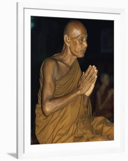 Buddhist Monk Meditating, Wat Suntorn, Bangkok, Thailand, Southeast Asia-John Henry Claude Wilson-Framed Photographic Print