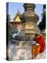 Buddhist Monk Reading a Book, Wat Xieng Thong, Luang Prabang, Laos, Indochina, Southeast Asia-Jane Sweeney-Stretched Canvas