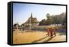 Buddhist Monks at a Square in Front of the Royal Palace, Phnom Penh, Cambodia, Indochina-Yadid Levy-Framed Stretched Canvas