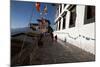 Buddhist Monks in Red Robes Walking in the Early Morning Sunshine-Annie Owen-Mounted Photographic Print