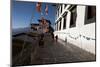 Buddhist Monks in Red Robes Walking in the Early Morning Sunshine-Annie Owen-Mounted Photographic Print