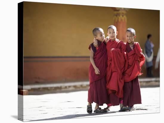 Buddhist Monks, Paro Dzong, Paro, Bhutan-Angelo Cavalli-Stretched Canvas