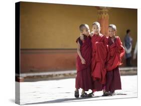 Buddhist Monks, Paro Dzong, Paro, Bhutan-Angelo Cavalli-Stretched Canvas