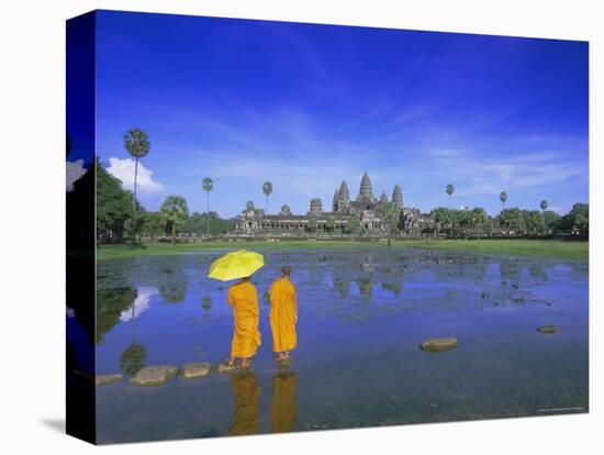 Buddhist Monks Standing in Front of Angkor Wat, Siem Reap, Cambodia-Gavin Hellier-Stretched Canvas