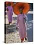 Buddhist Nuns with Bamboo-Framed Orange Umbrellas Walk Through Streets of Sittwe, Burma, Myanmar-Nigel Pavitt-Stretched Canvas