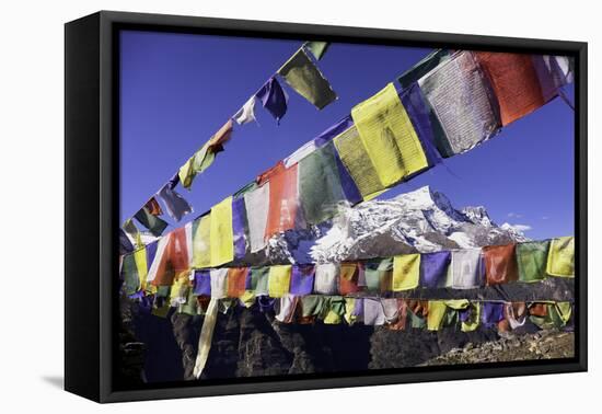 Buddhist Prayer Flags with Mount Kongde Ri Behind Taken Just Above the Town of Namche Bazaar-John Woodworth-Framed Stretched Canvas