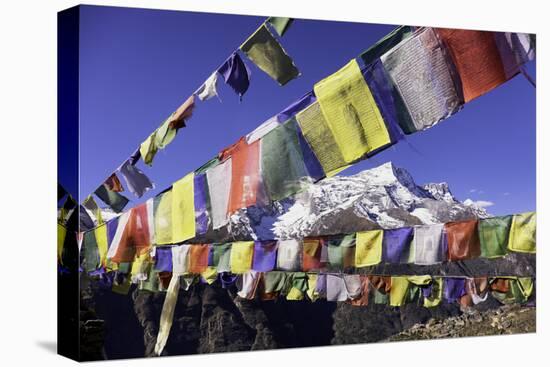 Buddhist Prayer Flags with Mount Kongde Ri Behind Taken Just Above the Town of Namche Bazaar-John Woodworth-Stretched Canvas
