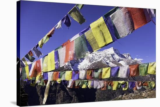 Buddhist Prayer Flags with Mount Kongde Ri Behind Taken Just Above the Town of Namche Bazaar-John Woodworth-Stretched Canvas