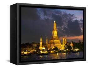 Buddhist Temple Lit Up at Dawn, Wat Arun, Chao Phraya River, Bangkok, Thailand-null-Framed Stretched Canvas