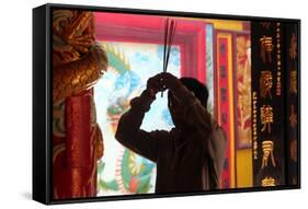 Buddhist worshipper burning incense sticks, Chua On Lang Taoist Temple-Godong-Framed Stretched Canvas