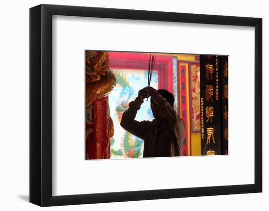 Buddhist worshipper burning incense sticks, Chua On Lang Taoist Temple-Godong-Framed Photographic Print