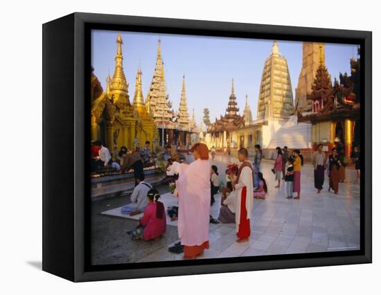 Buddhist Worshippers at the Shwedagon Paya (Shwe Dagon Pagoda), Yangon (Rangoon), Myanmar (Burma)-Christina Gascoigne-Framed Stretched Canvas
