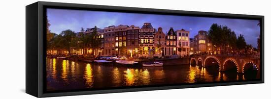 Buildings Along a Canal at Dusk, Amsterdam, Netherlands-null-Framed Stretched Canvas